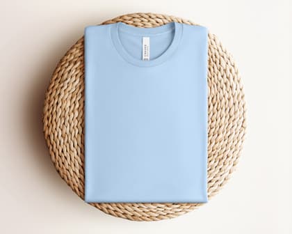 Bella+Canvas 3001 — Folded on Rattan mockup in Baby Blue
