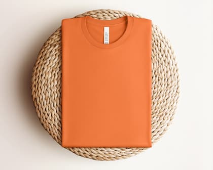 Bella+Canvas 3001 — Folded on Rattan mockup in Burnt Orange