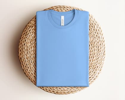 Bella+Canvas 3001 — Folded on Rattan mockup in Carolina Blue