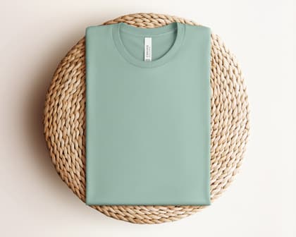 Bella+Canvas 3001 — Folded on Rattan mockup in Dusty Blue