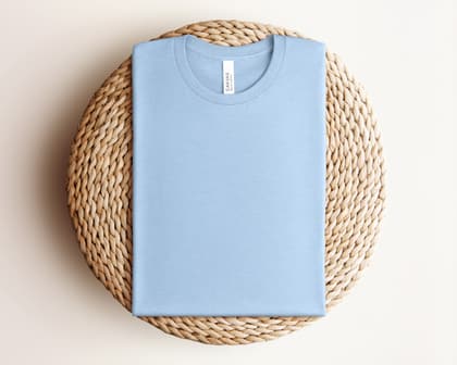 Bella+Canvas 3001 — Folded on Rattan mockup in Heather Baby Blue