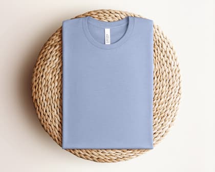 Bella+Canvas 3001 — Folded on Rattan mockup in Heather Blue