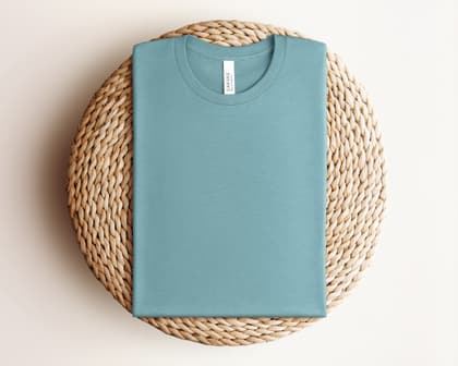 Bella+Canvas 3001 — Folded on Rattan mockup in Heather Blue Lagoon