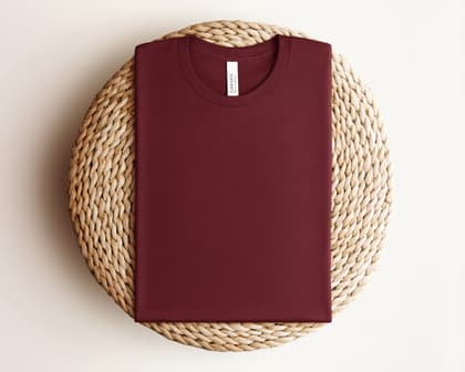 Bella+Canvas 3001 — Folded on Rattan mockup in Heather Cardinal