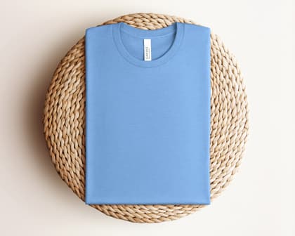 Bella+Canvas 3001 — Folded on Rattan mockup in Heather Carolina Blue