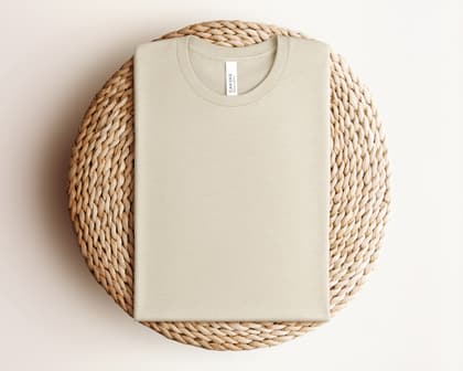 Bella+Canvas 3001 — Folded on Rattan mockup in Heather Dust