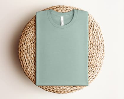 Bella+Canvas 3001 — Folded on Rattan mockup in Heather Dusty Blue