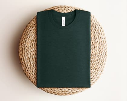 Bella+Canvas 3001 — Folded on Rattan mockup in Heather Emerald