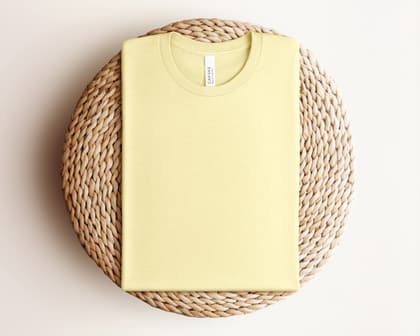 Bella+Canvas 3001 — Folded on Rattan mockup in Heather French Vanilla