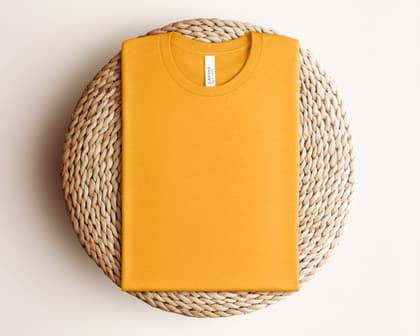 Bella+Canvas 3001 — Folded on Rattan mockup in Heather Gold