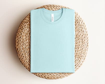 Bella+Canvas 3001 — Folded on Rattan mockup in Heather Ice Blue