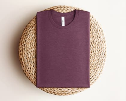 Bella+Canvas 3001 — Folded on Rattan mockup in Heather Maroon