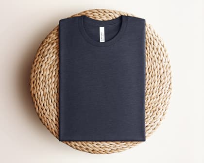 Bella+Canvas 3001 — Folded on Rattan mockup in Heather Midnight Navy