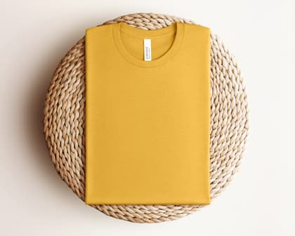 Bella+Canvas 3001 — Folded on Rattan mockup in Heather Mustard