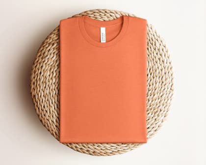 Bella+Canvas 3001 — Folded on Rattan mockup in Heather Orange