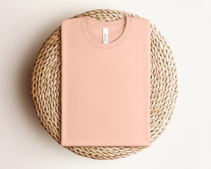 Bella+Canvas 3001 — Folded on Rattan mockup in Heather Peach