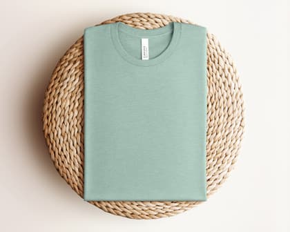 Bella+Canvas 3001 — Folded on Rattan mockup in Heather Prism Dusty Blue