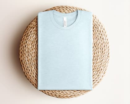 Bella+Canvas 3001 — Folded on Rattan mockup in Heather Prism Ice Blue