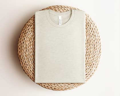 Bella+Canvas 3001 — Folded on Rattan mockup in Heather Prism Natural