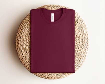 Bella+Canvas 3001 — Folded on Rattan mockup in Maroon