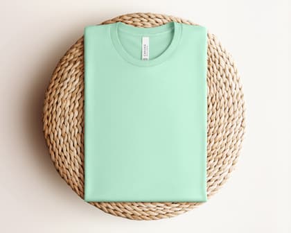 Bella+Canvas 3001 — Folded on Rattan mockup in Mint