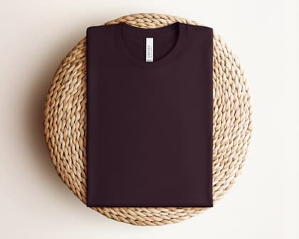 Bella+Canvas 3001 — Folded on Rattan mockup in Oxblood Black