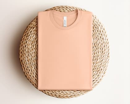 Bella+Canvas 3001 — Folded on Rattan mockup in Peach