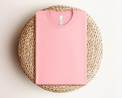 Bella+Canvas 3001 — Folded on Rattan mockup in Pink