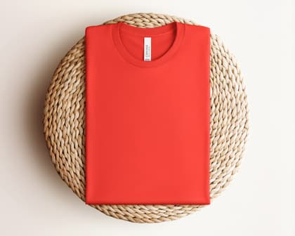 Bella+Canvas 3001 — Folded on Rattan mockup in Poppy