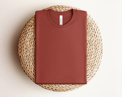 Bella+Canvas 3001 — Folded on Rattan mockup in Rust