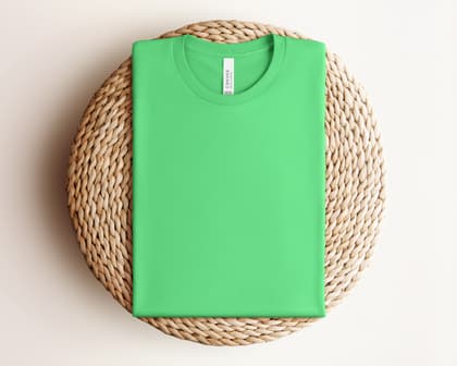 Bella+Canvas 3001 — Folded on Rattan mockup in Synthetic Green