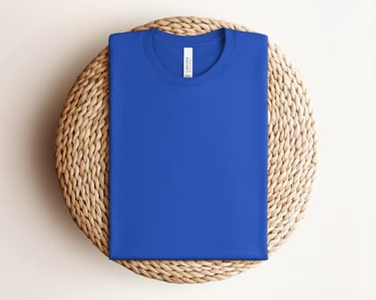Bella+Canvas 3001 — Folded on Rattan mockup in True Royal