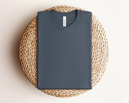 Bella+Canvas 3001 — Folded on Rattan mockup in Vintage Navy