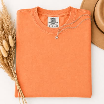 Comfort Colors® 1717 — Folded with Props mockup in Melon