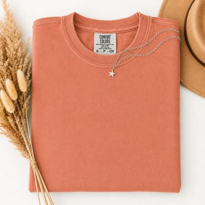 Comfort Colors® 1717 — Folded with Props mockup in Terracotta