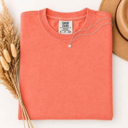 Comfort Colors® 1717 — Folded with Props mockup in Bright Salmon