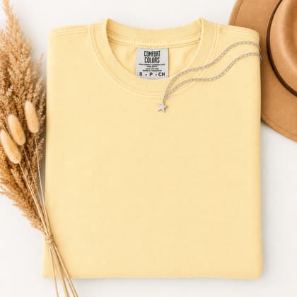 Comfort Colors® 1717 — Folded with Props mockup in Banana