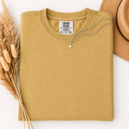 Comfort Colors® 1717 — Folded with Props mockup in Mustard