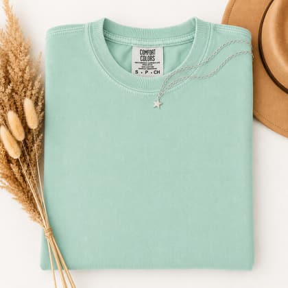 Comfort Colors® 1717 — Folded with Props mockup in Island Reef
