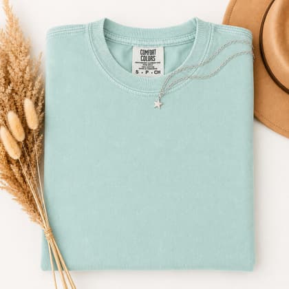 Comfort Colors® 1717 — Folded with Props mockup in Chalky Mint