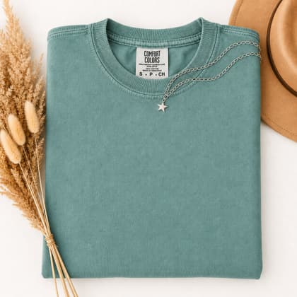 Comfort Colors® 1717 — Folded with Props mockup in Seafoam