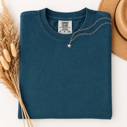 Comfort Colors® 1717 — Folded with Props mockup in Topaz Blue