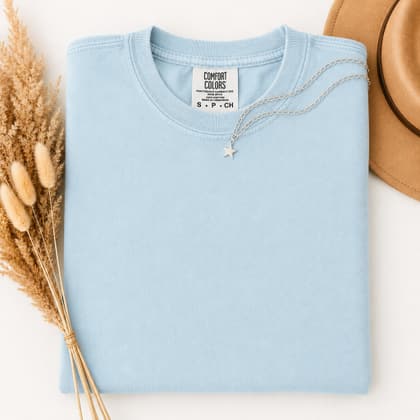 Comfort Colors® 1717 — Folded with Props mockup in Chambray