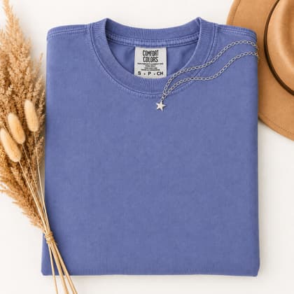Comfort Colors® 1717 — Folded with Props mockup in Periwinkle