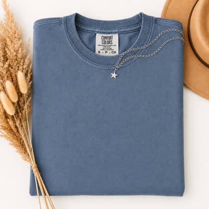 Comfort Colors® 1717 — Folded with Props mockup in Mystic Blue