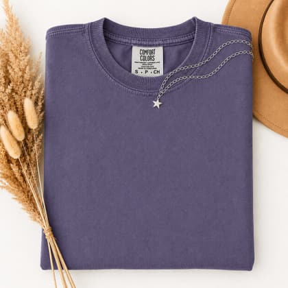 Comfort Colors® 1717 — Folded with Props mockup in Grape