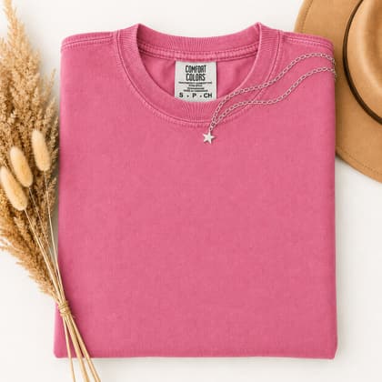Comfort Colors® 1717 — Folded with Props mockup in Heliconia
