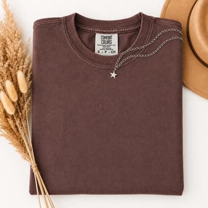 Comfort Colors® 1717 — Folded with Props mockup in Vineyard