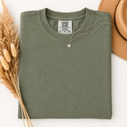 Comfort Colors® 1717 — Folded with Props mockup in Moss