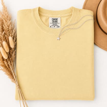 Comfort Colors® 1717 — Folded with Props mockup in Butter